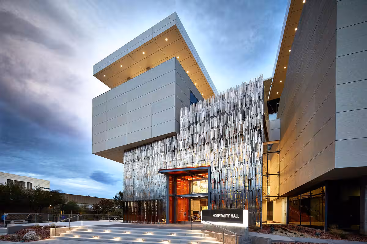 UNLV's Hospitality Hall, home of the William F. Harrah College of Hospitality, at dusk